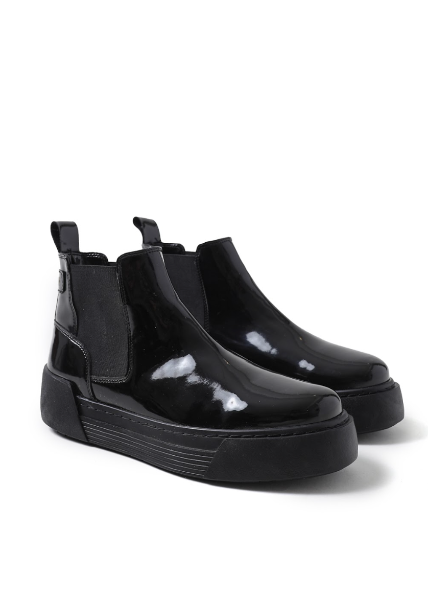 Front Side shot of black patent Avalon Chelsea Apollo boots with cushioned platform sole.