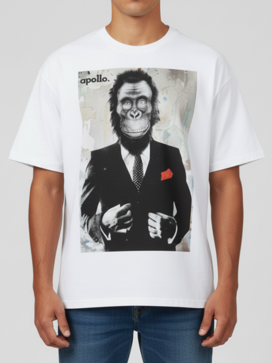 Person wearing a white t-shirt with a graphic of a chimpanzee in a suit and tie.