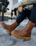 Lifestyle shot of Zenith Tan Chelsea Boots by Apollo Moda in tan leather with matching elastic panels and a tonal sole.